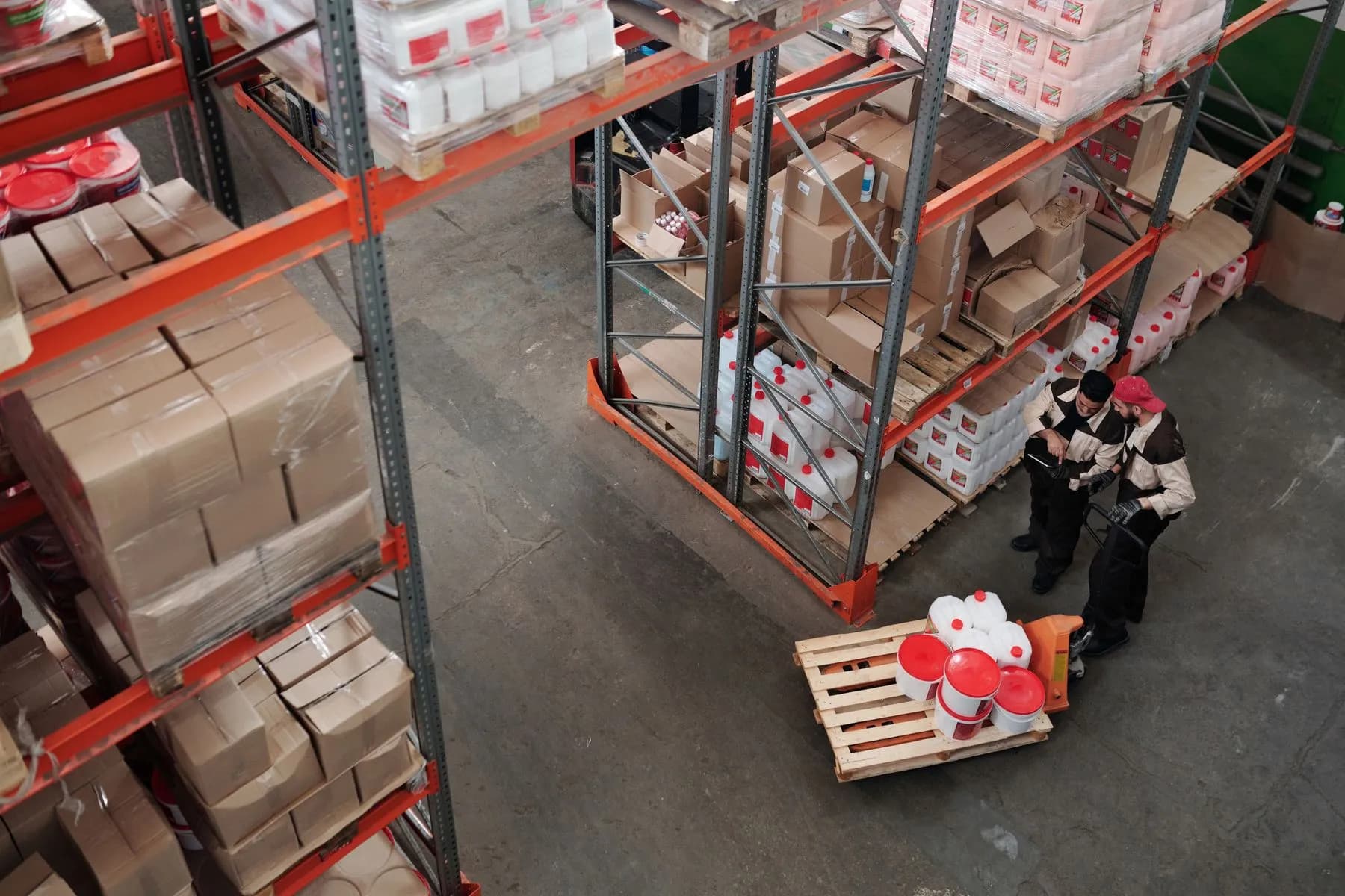 Warehouse staff verifying inventory in a storage area